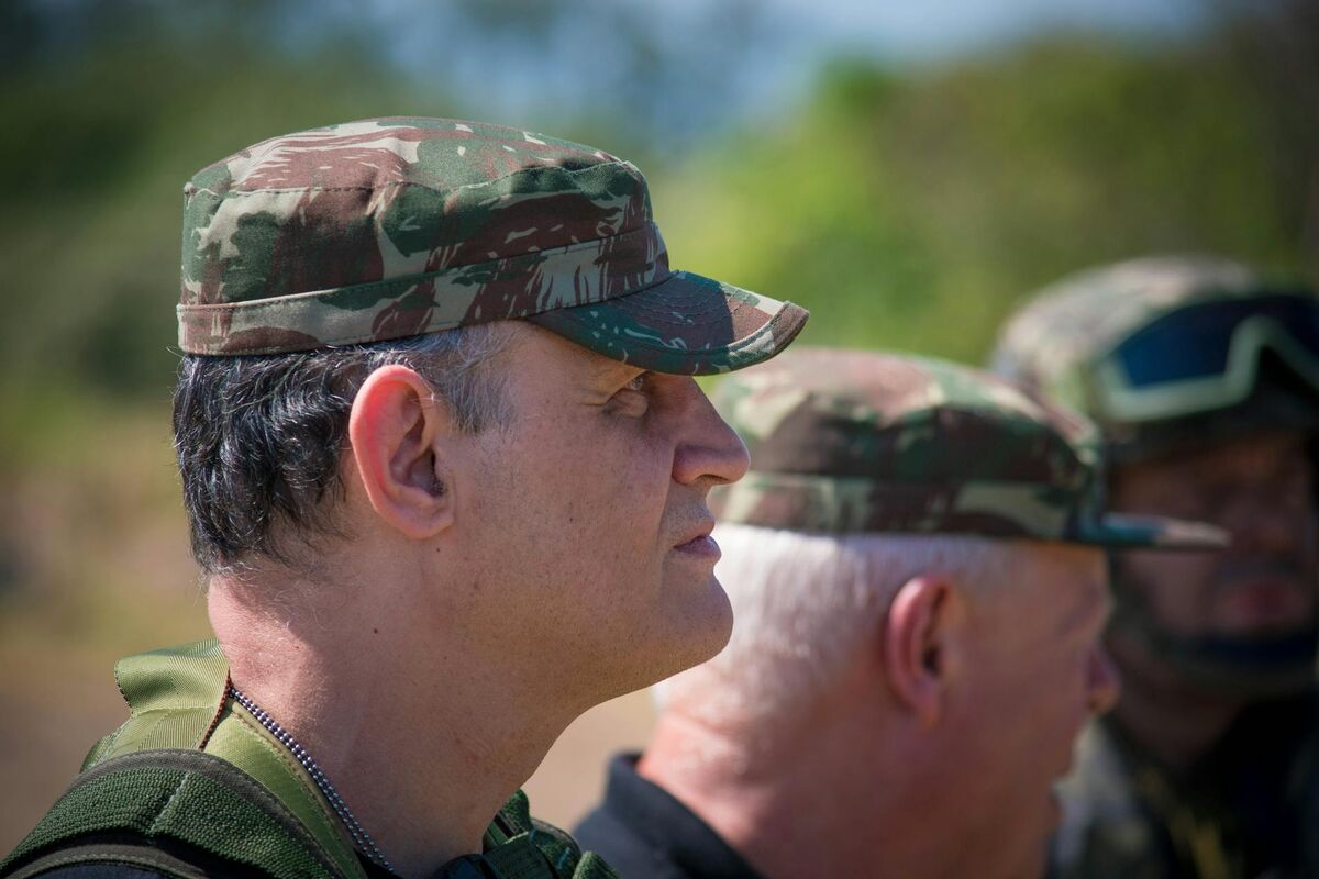 Military veteran drone operator conducting field training with commercial UAV