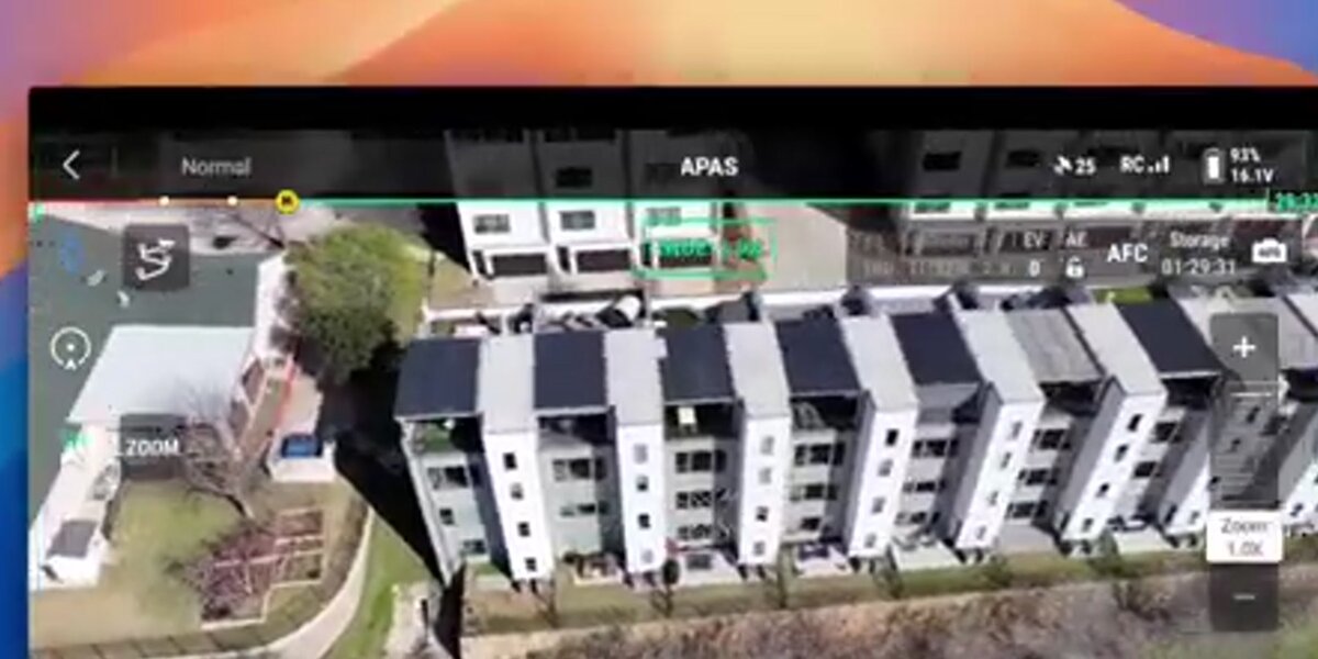 Aerial drone view of apartment buildings being captured for digital twin creation with SkyeBrowse