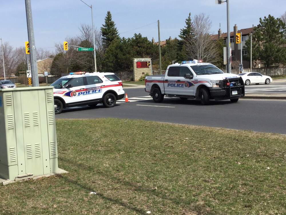 Traffic accident investigation scene with emergency vehicles