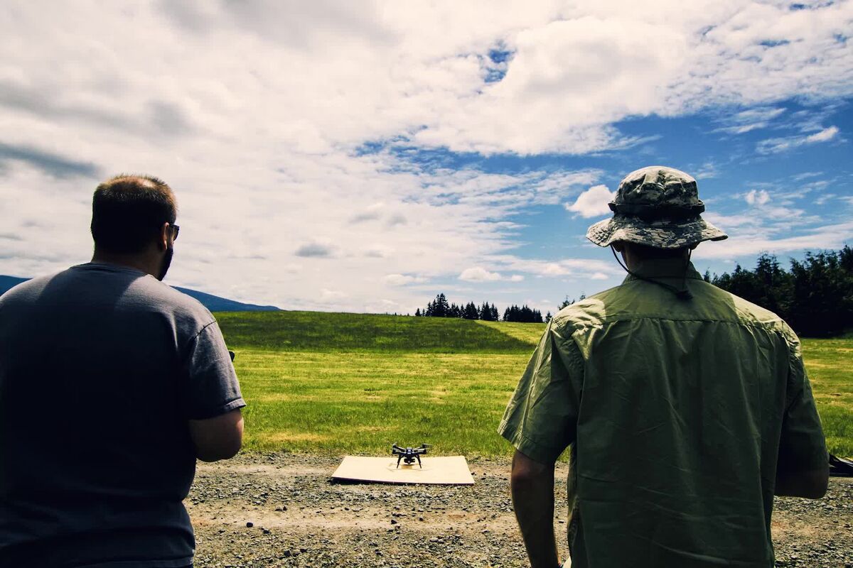 Close-up of drone propeller and motor inspection during preflight check