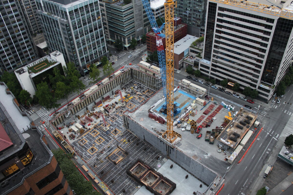Aerial view of a hotel construction site showing active building work and crane operations