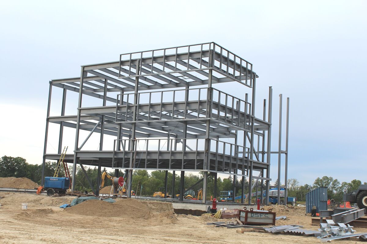 Steel frame commercial building under construction showing structural progress documentation