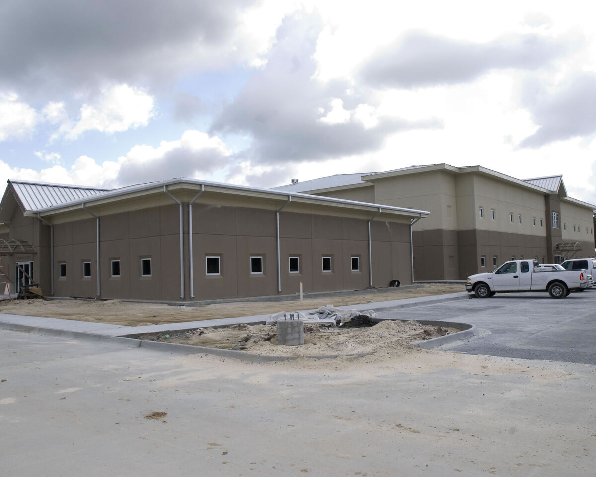 Emergency operations center coordinating multi-agency disaster response with real-time situational maps