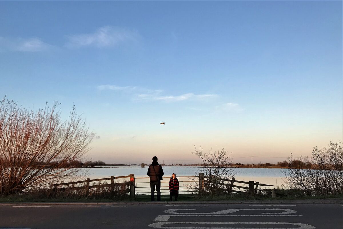 Drone operator preparing for aerial 3D mapping survey
