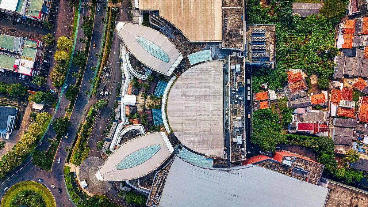 Aerial drone view of commercial building and surrounding property