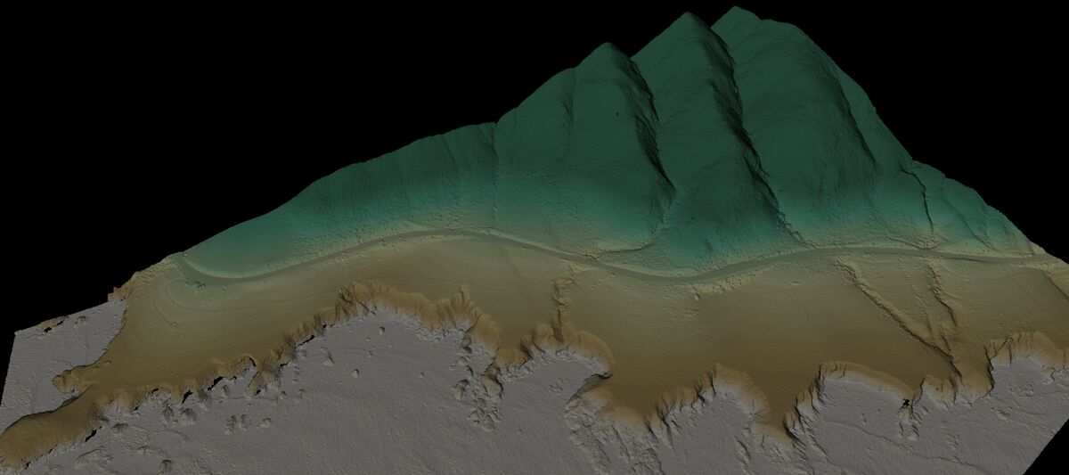 LiDAR elevation model of a road corridor in California showing color-coded terrain height