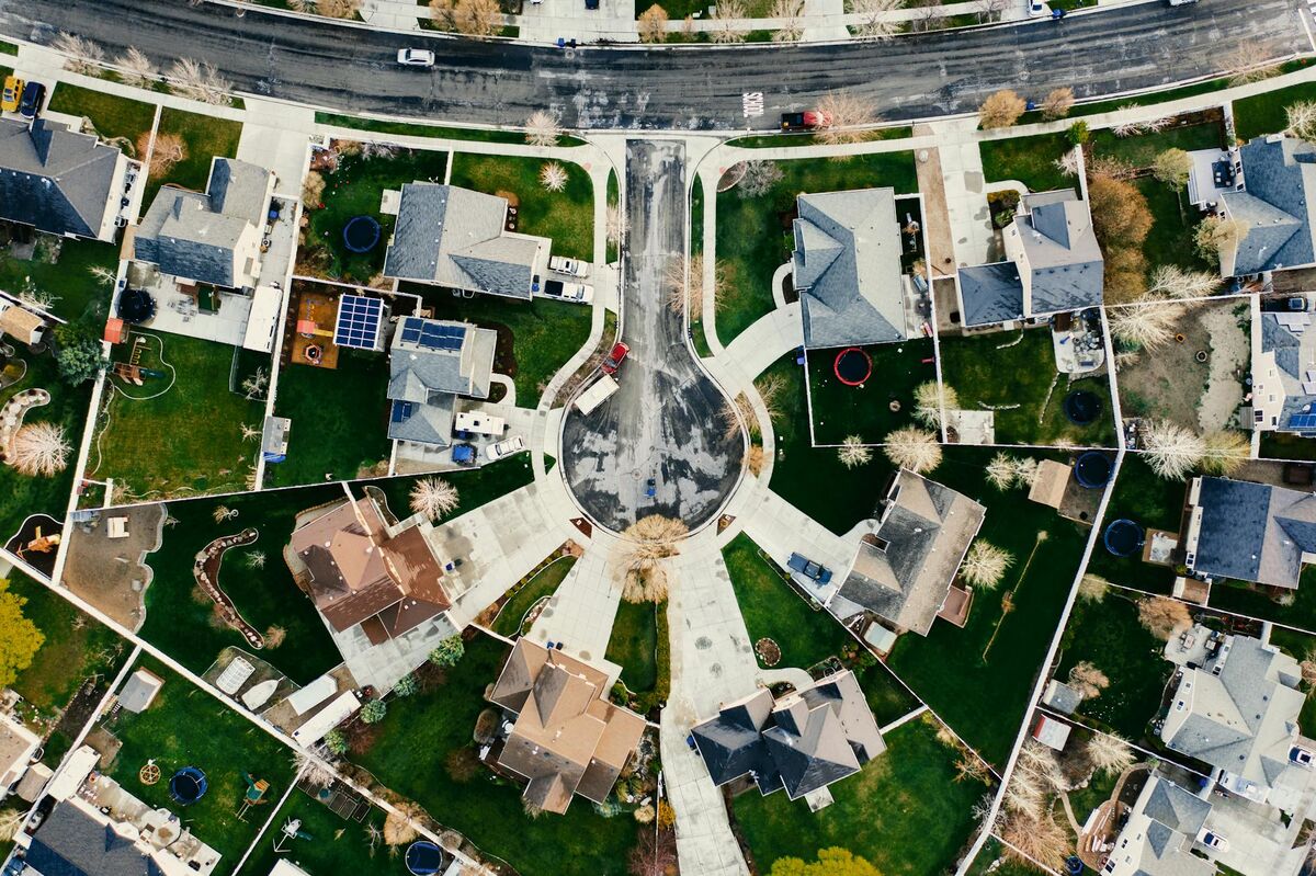 Aerial drone view of a residential neighborhood in Utah showing rooftops and home layouts