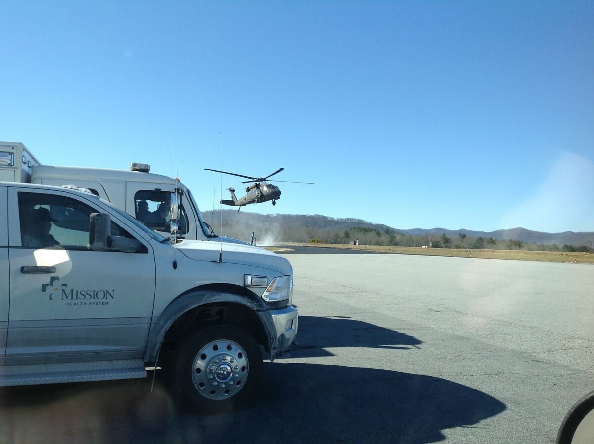 Search and rescue team responding to a missing hiker in a mountain wilderness during a winter storm